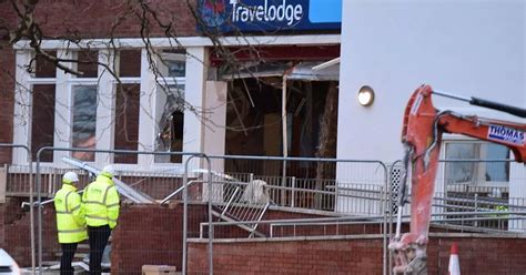 guy destroys building with mini excavator|Liverpool TraveLodge digger: Man destroys entrance after .